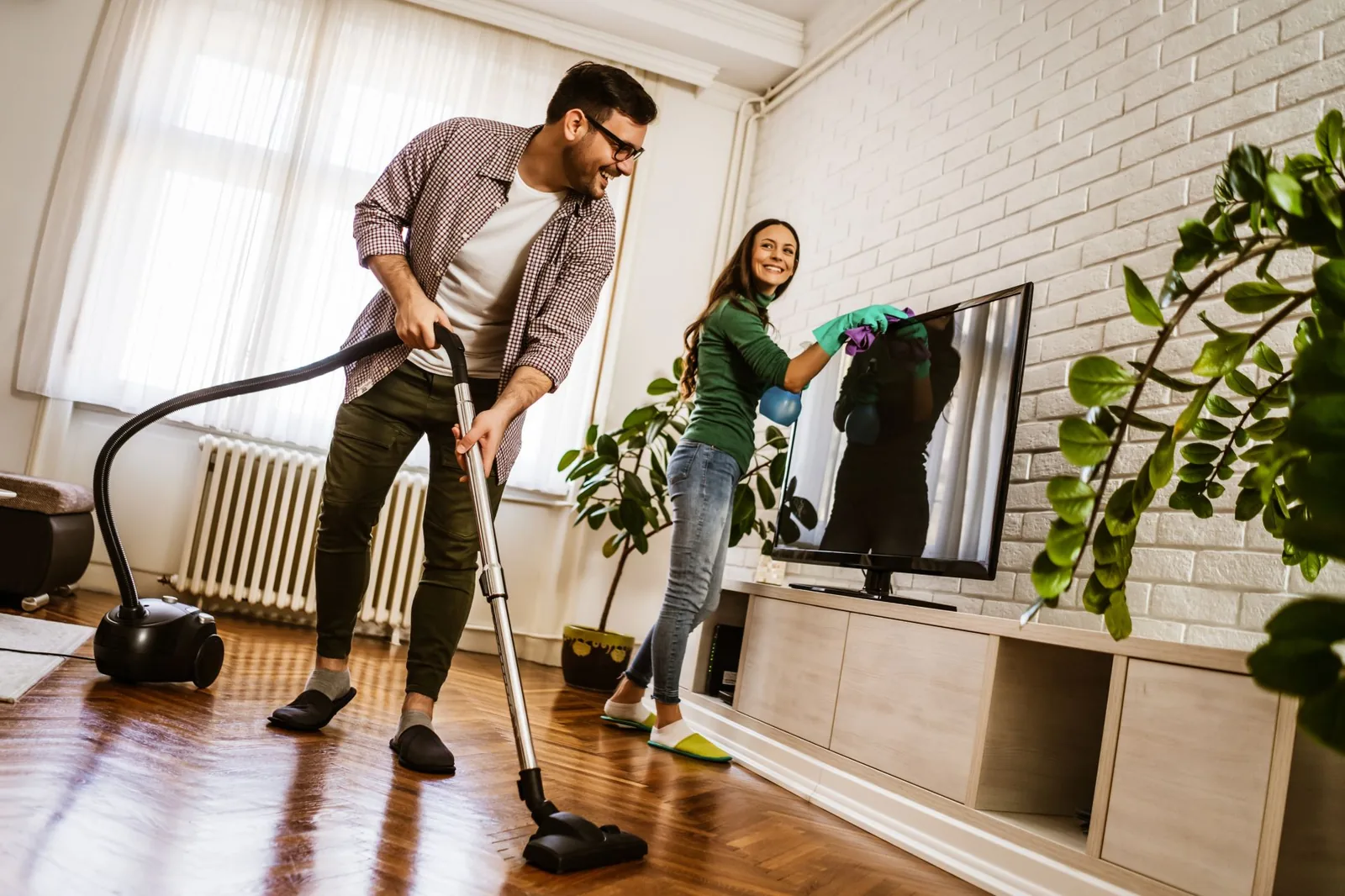 Couple cleaning their NYC home