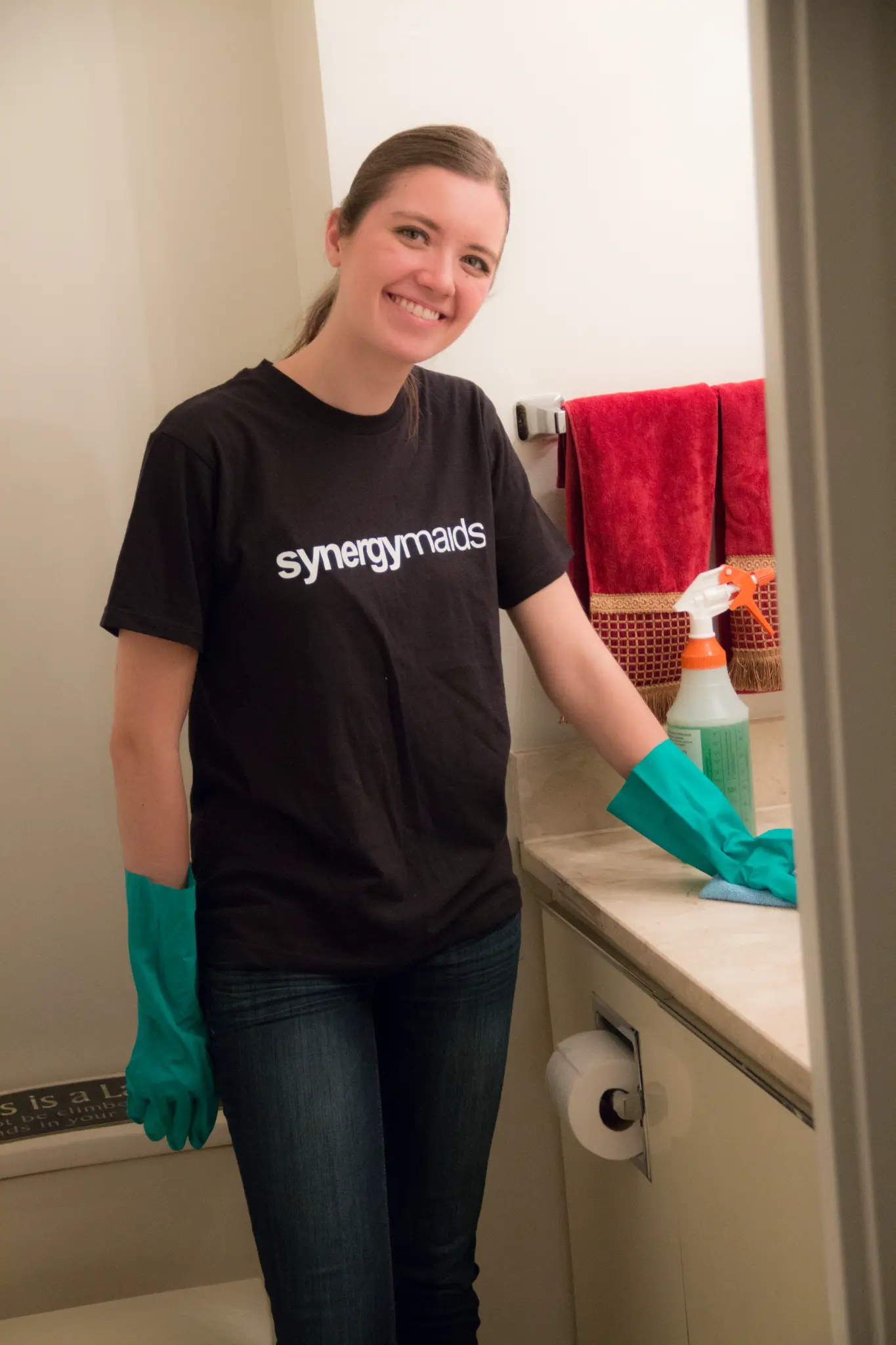Synergy Maids cleaner at work in a bright NYC apartment